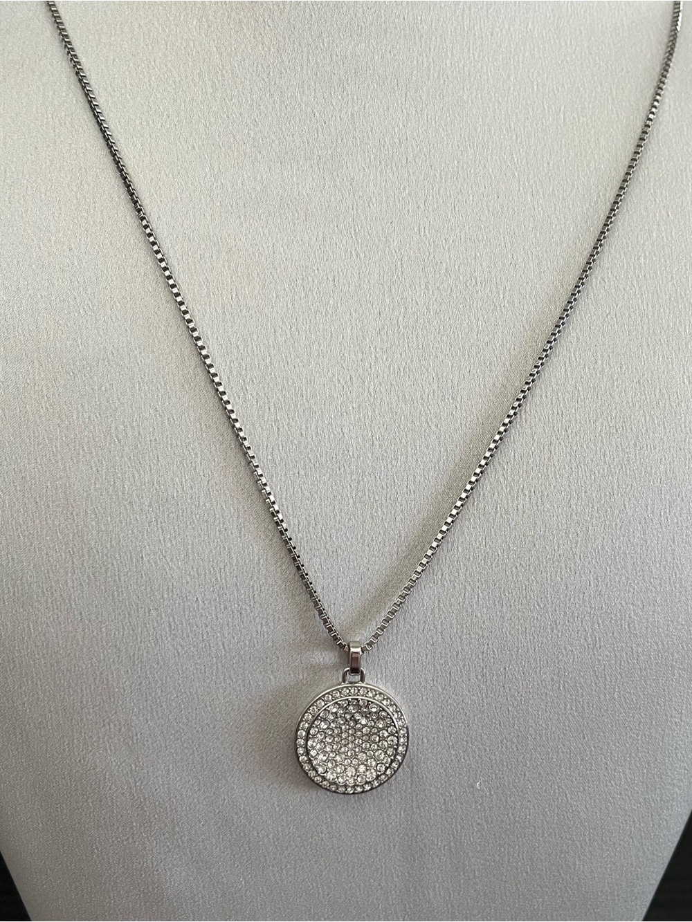 Michael Kors silver tone long necklace with crystal round pendant